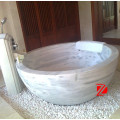 white marble round bathtub